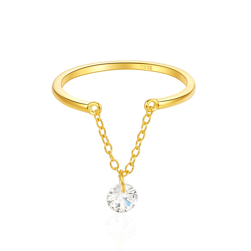 A hand modeling an adjustable open-chain ring with a single solitaire diamond, crafted from polished S925 silver. The minimalist design features a sleek chain link band, styled with both casual denim and a tailored blazer for versatile sophistication.
