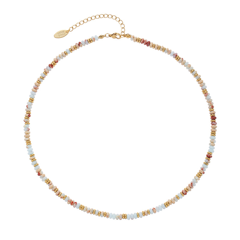 This elegant aqua blue gemstone beaded necklace from ChicBlingBabe features a minimalist design, making it a stylish layering piece for everyday wear or special occasions. The natural stone beads add a unique charm, blending boho and modern aesthetics effortlessly.