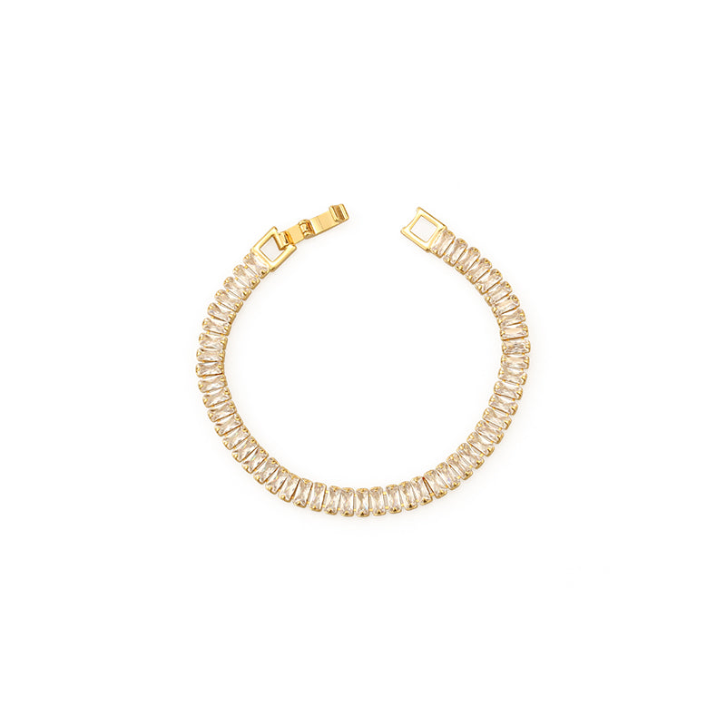 A stylish gold and silver chunky chain bracelet with sparkling accents, worn at a summer rooftop party, adding a bold yet elegant statement to any chic outfit.