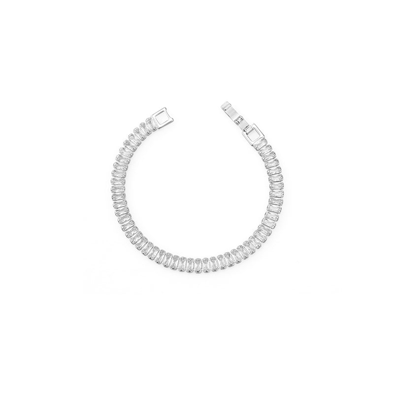 A stylish gold and silver chunky chain bracelet with sparkling accents, worn at a summer rooftop party, adding a bold yet elegant statement to any chic outfit.