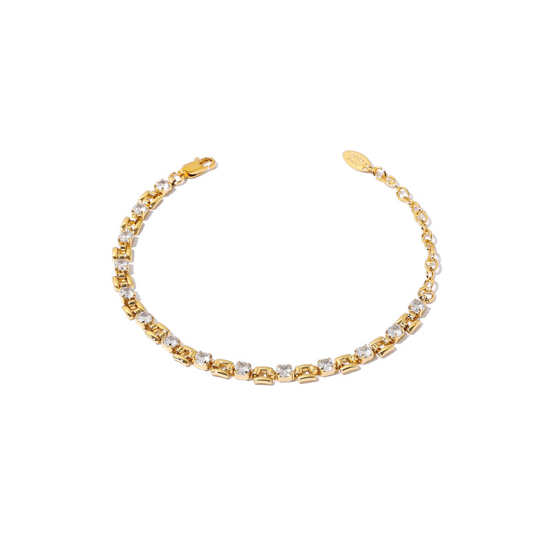 The image shows a chic 18K gold-plated brass bracelet featuring square zircon stones with a lock clasp. Its minimalist design with sleek lines and square zircon stones gives it a cool luxe look, perfect for daily wear or casual outings. This bracelet from Chicblingbabe is ideal for modern women who appreciate subtle luxury and fashion-forward accessories.
