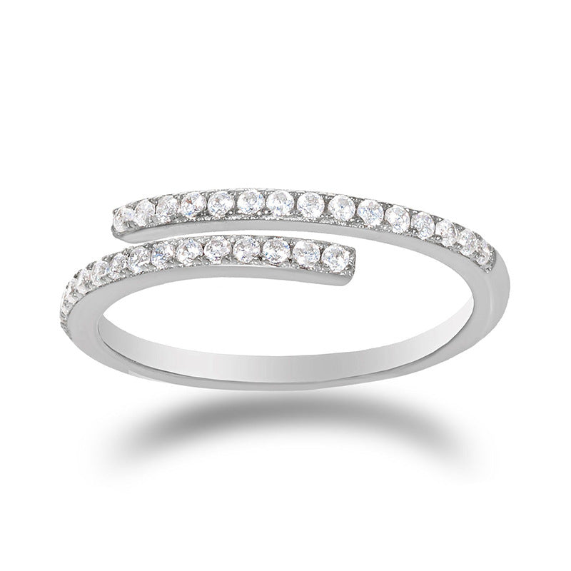 A model's hand styled with a double row cubic zirconia cuff ring in polished S925 silver, layered with thin delicate rings for contrast. The bold geometric design catches light dramatically, perfect for creating viral Instagram reels or elevating cocktail party outfits with modern edge.