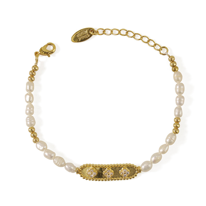 This image shows the ChicBlingBabe elegant freshwater pearl bracelet, enhanced with zircon accents and gold plated brass, perfect for elegant occasions, daily wear, or adding luxury to a chic outfit.