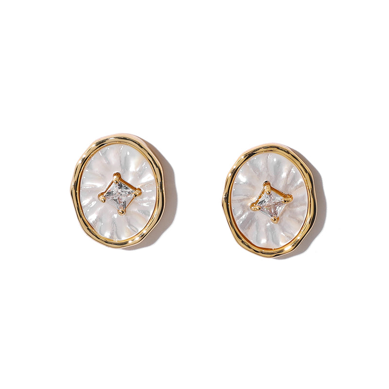 These exquisite stud earrings feature a lustrous mother-of-pearl centerpiece, delicately accented with sparkling zircon stones. The gold-tone setting enhances their vintage charm, making them a perfect choice for elegant evening wear or everyday sophistication.