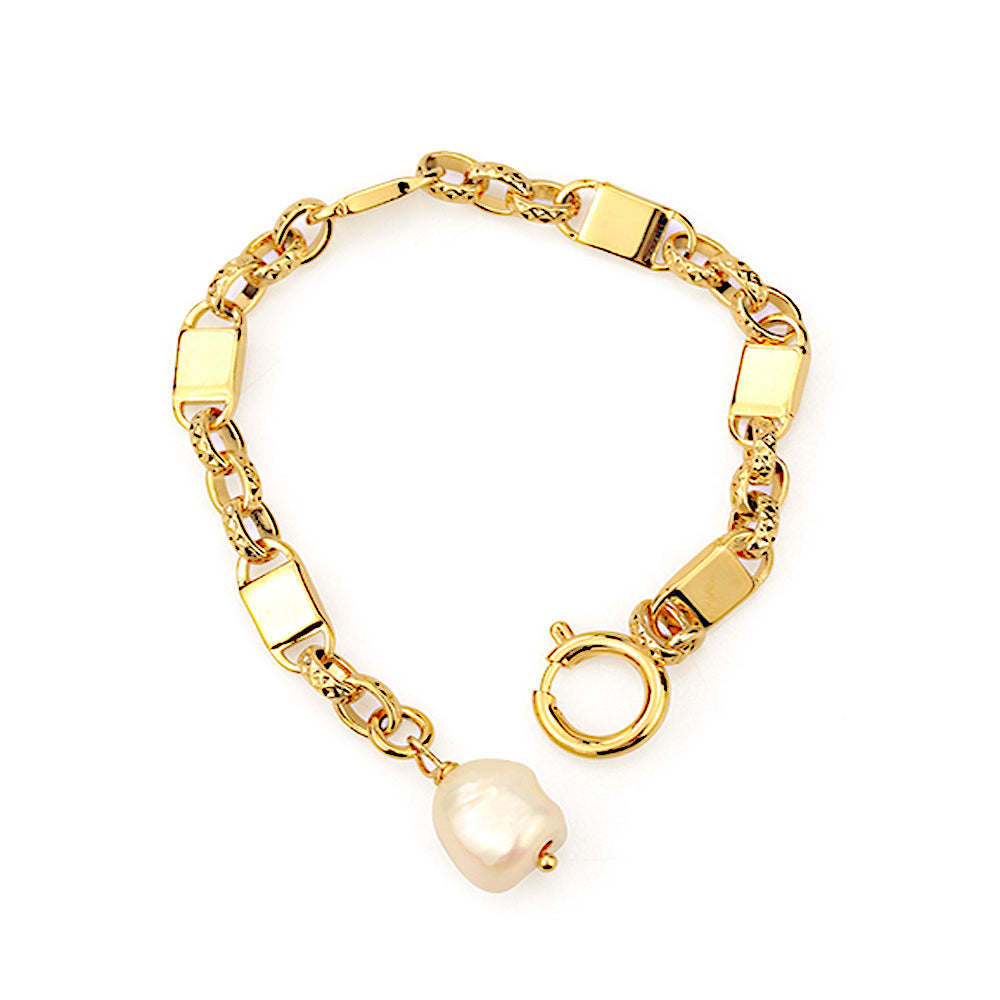 This image showcases an elegant pearl pendant bracelet featuring a delicate gold-tone chain and a lustrous natural pearl centerpiece. Designed for effortless sophistication, this bracelet is perfect for daily wear, evening events, and layering with other jewelry pieces. The timeless combination of a refined gold chain and a radiant pearl makes it an exquisite addition to any jewelry collection, offering both vintage charm and modern elegance.