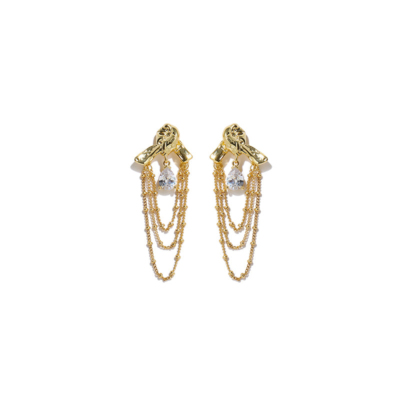This image features a pair of elegant teardrop tassel earrings with a sparkling zircon accent, designed in a sophisticated knotted shape. The shimmering gold finish enhances their luxury appeal, making them an ideal choice for evening events, parties, and special occasions. These statement dangle earrings combine modern glamour with timeless elegance, perfect for women who love stylish and refined jewelry.
