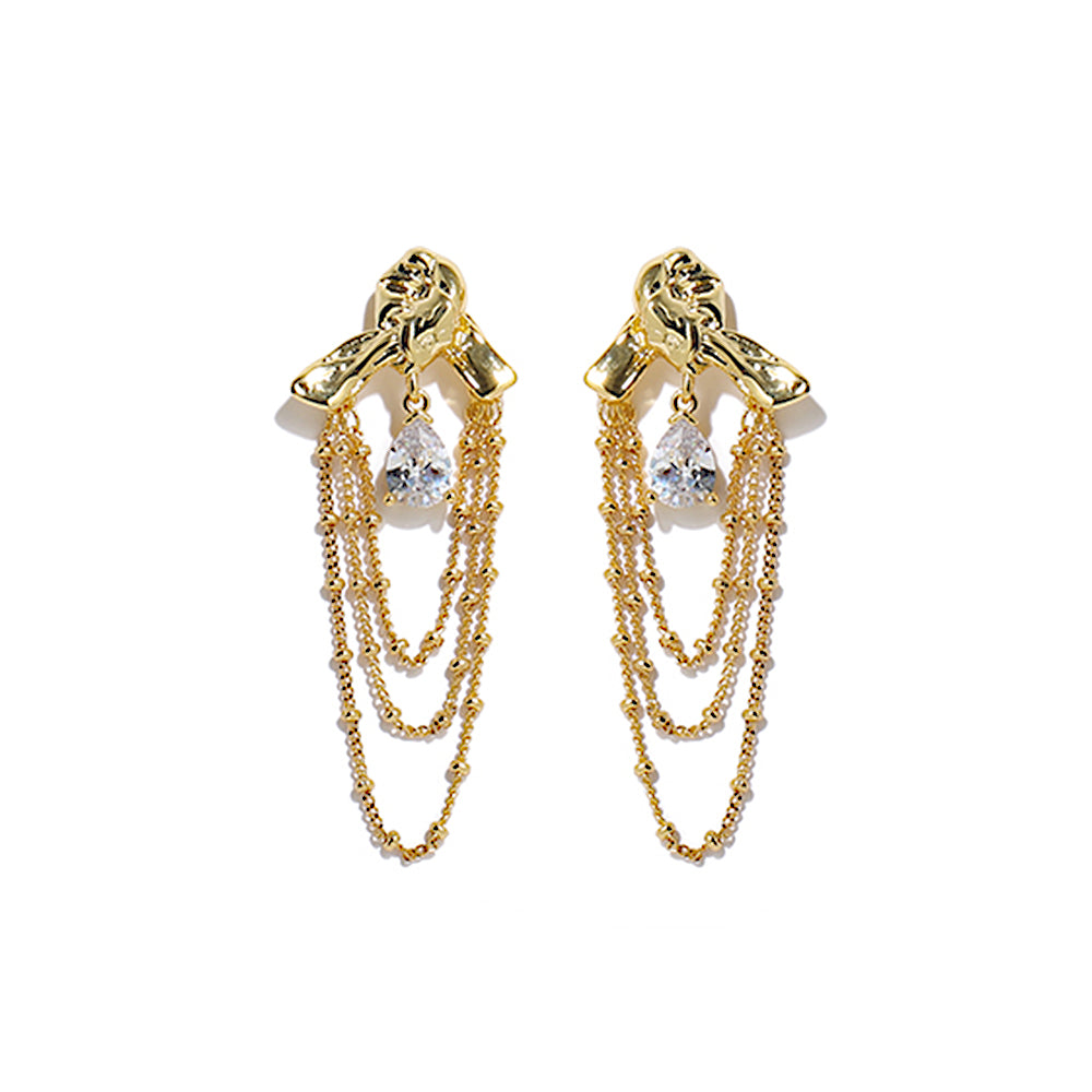 This image features a pair of elegant teardrop tassel earrings with a sparkling zircon accent, designed in a sophisticated knotted shape. The shimmering gold finish enhances their luxury appeal, making them an ideal choice for evening events, parties, and special occasions. These statement dangle earrings combine modern glamour with timeless elegance, perfect for women who love stylish and refined jewelry.