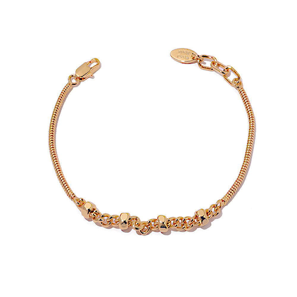 This image features a ChicBlingBabe hexagon-inspired snake chain bracelet in polished gold, designed for minimalist stacking looks and ideal for elevating both casual and dressy outfits.