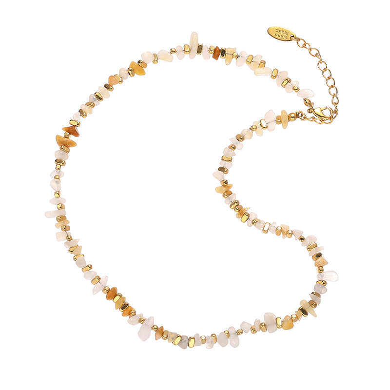 This stunning irregular natural stone beaded necklace from ChicBlingBabe features vibrant, multicolored gemstones set in a delicate gold-tone chain. The unique bohemian-inspired design makes it a perfect accessory for casual outfits or special occasions, adding an artistic touch to your jewelry collection.