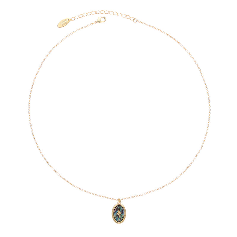 This image features the ChicBlingBabe gold-toned layered necklace designed with natural pearls, abalone shell, and irregular stones, perfect for beachside vacations or summer boho fashion with its ocean-inspired elegance.