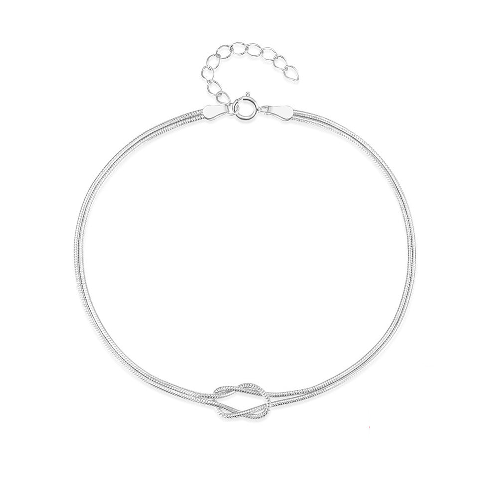 A couple wearing matching luxe snake chain bracelets made of S925 sterling silver, featuring a minimalist Korean-inspired design in polished silver tone. The bracelets are styled with casual outfits for daily wear, ideal as unisex love gifts or minimalist jewelry accessories.