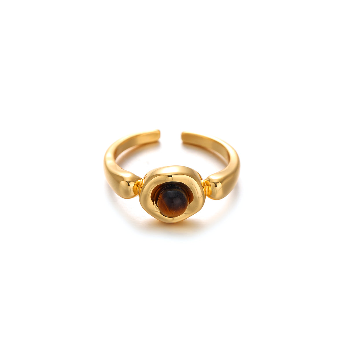 A model's hand wearing a luxe tiger eye stone ring with golden striations, paired with a cashmere sweater and leather gloves for autumn styling. The hypoallergenic brass band maintains its gold-plated finish against winter elements, while the stone's amber hues transition seamlessly from daytime meetings to evening events.
