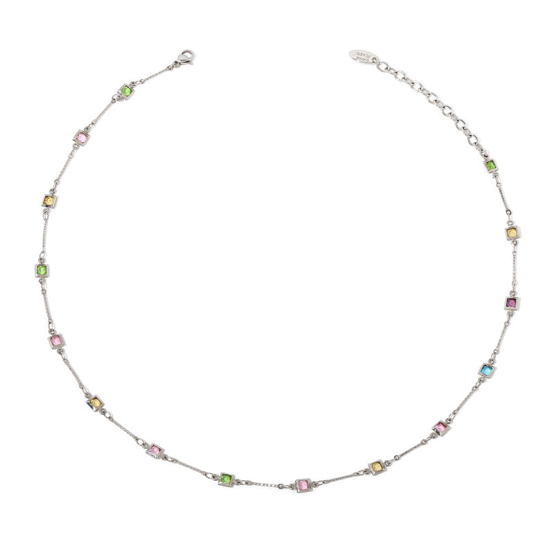 This image showcases a delicate rainbow glass bead necklace with evenly spaced multicolored beads along a fine gold or platinum chain. The dainty and minimalist design makes it perfect for layering with other jewelry or wearing alone for a subtle statement. Ideal for daily wear, casual outings, or gifting, this trendy necklace adds a vibrant and elegant touch to any look.