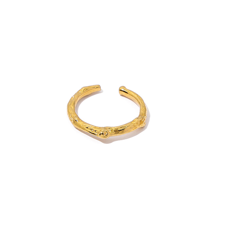 This sleek twisted stacking ring in gold features an open-band design with elegant hollow details, making it a stylish choice for layering or wearing alone. Perfect for daily wear or special occasions, this minimalist vintage-inspired piece adds sophistication to any look.