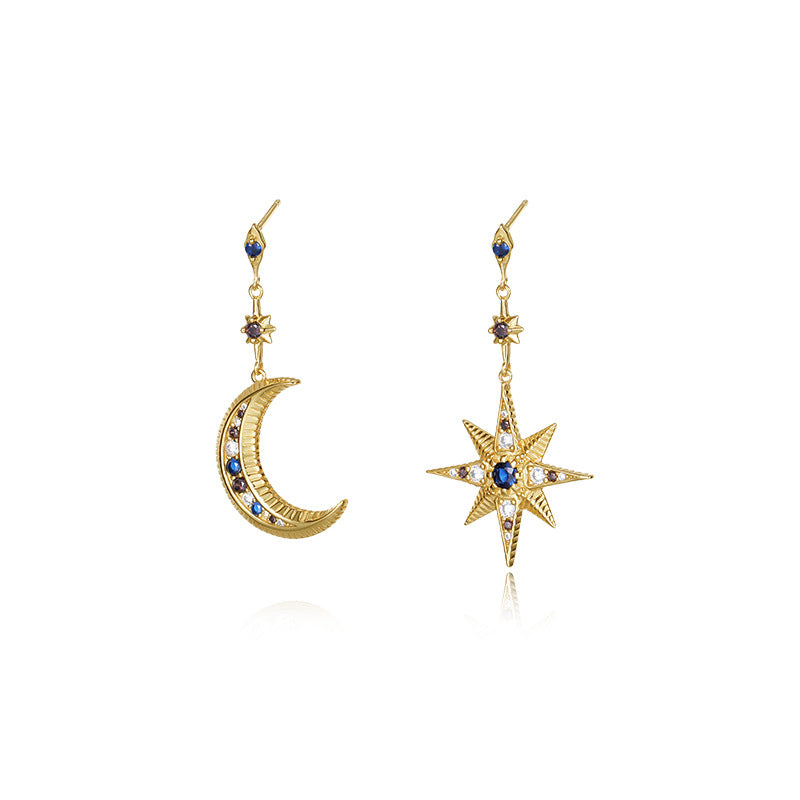 A model wearing asymmetric star and moon zirconia earrings made of 925 sterling silver, featuring colorful gemstones in a minimalist European design. The earrings are styled for casual or formal outfits, perfect as a unique gift for special occasions.