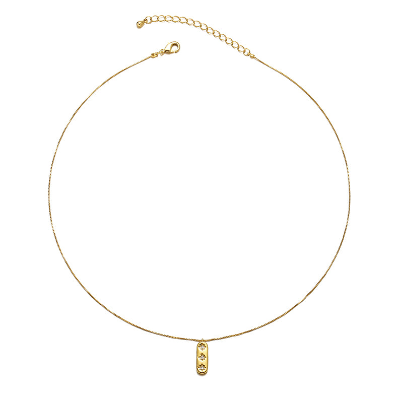 A gold-tone pendant necklace featuring a starburst design adorned with a shimmering zircon stone on a round charm. This celestial-inspired piece complements both casual and formal outfits, making it a perfect minimalist accessory for layering or wearing alone.
