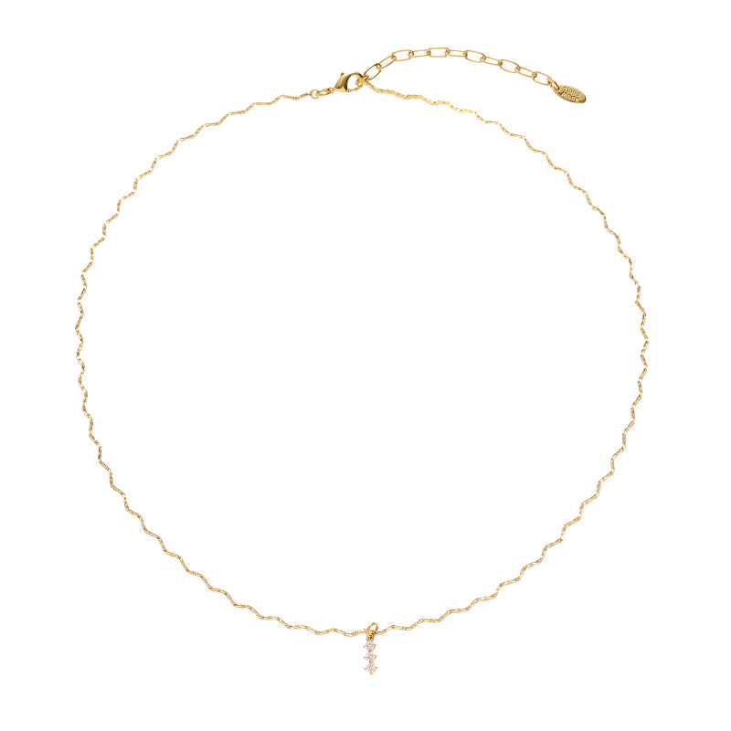 This image features the ChicBlingBabe gold wavy chain necklace adorned with subtle zircon accents, ideal for daily wear, work settings, or minimalist chic ensembles, adding a stylish gleam to both casual and office outfits.