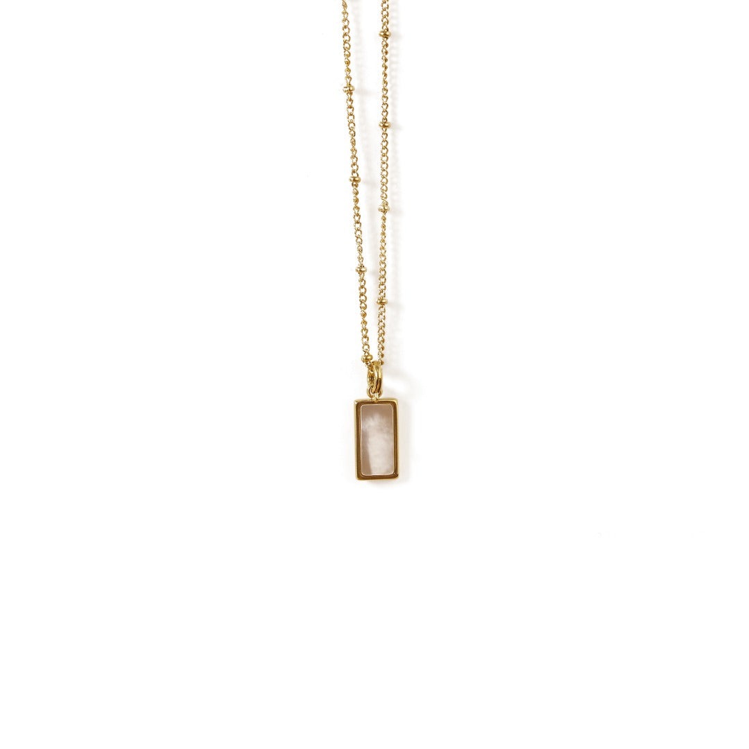This image features a ChicBlingBabe necklace with a gold-tone chain and a round shell and malachite pendant, perfect for adding timeless elegance to workwear, casual outfits, or thoughtful gift occasions.