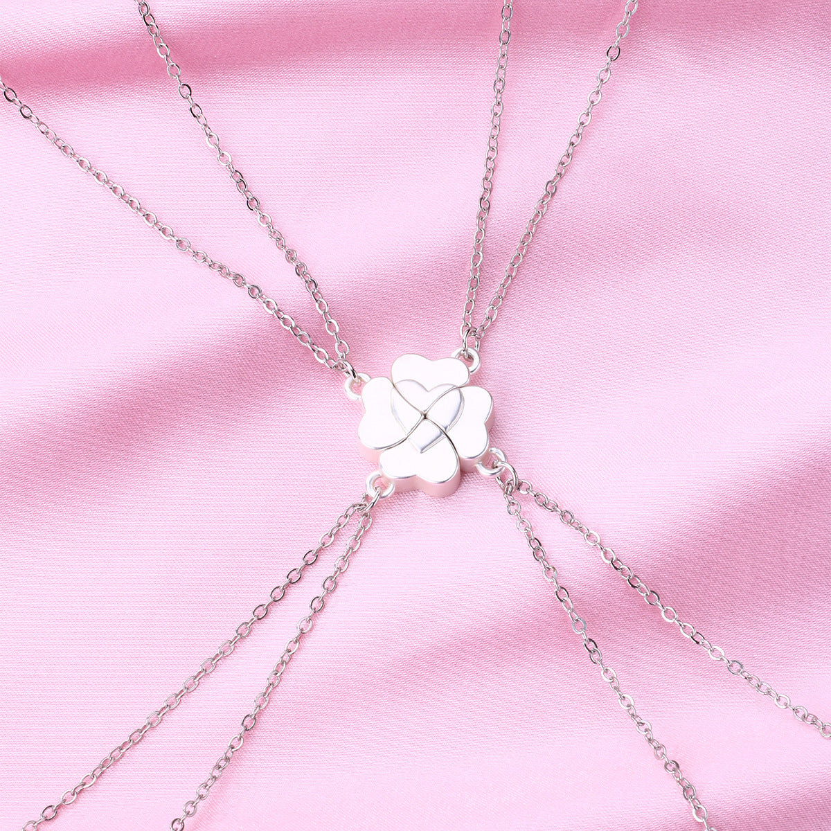 This image shows a set of four silver clover-shaped magnetic necklaces from ChicBlingBabe, each pendant forming a part of a four-petal design that connects perfectly with the others, ideal for best friends, family, or group gifts, suitable for birthdays, reunions, or everyday wear, and styled to express love, unity, and lasting bonds.