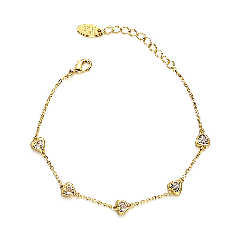 This image showcases a vintage heart zircon bracelet with elegant heart-shaped zircon stones embedded in an 18K gold-plated brass base. The stylish French-inspired design makes it perfect for adding a chic touch to any summer outfit, whether casual or semi-formal. The Chicblingbabe Vintage Heart Zircon Bracelet is a sophisticated accessory that enhances your jewelry collection.